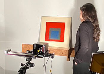 Hortense de La Codre sets up the hyperspectral imaging (HSI) scan of one of the many paintings in Albers’ Homage to the Square series.